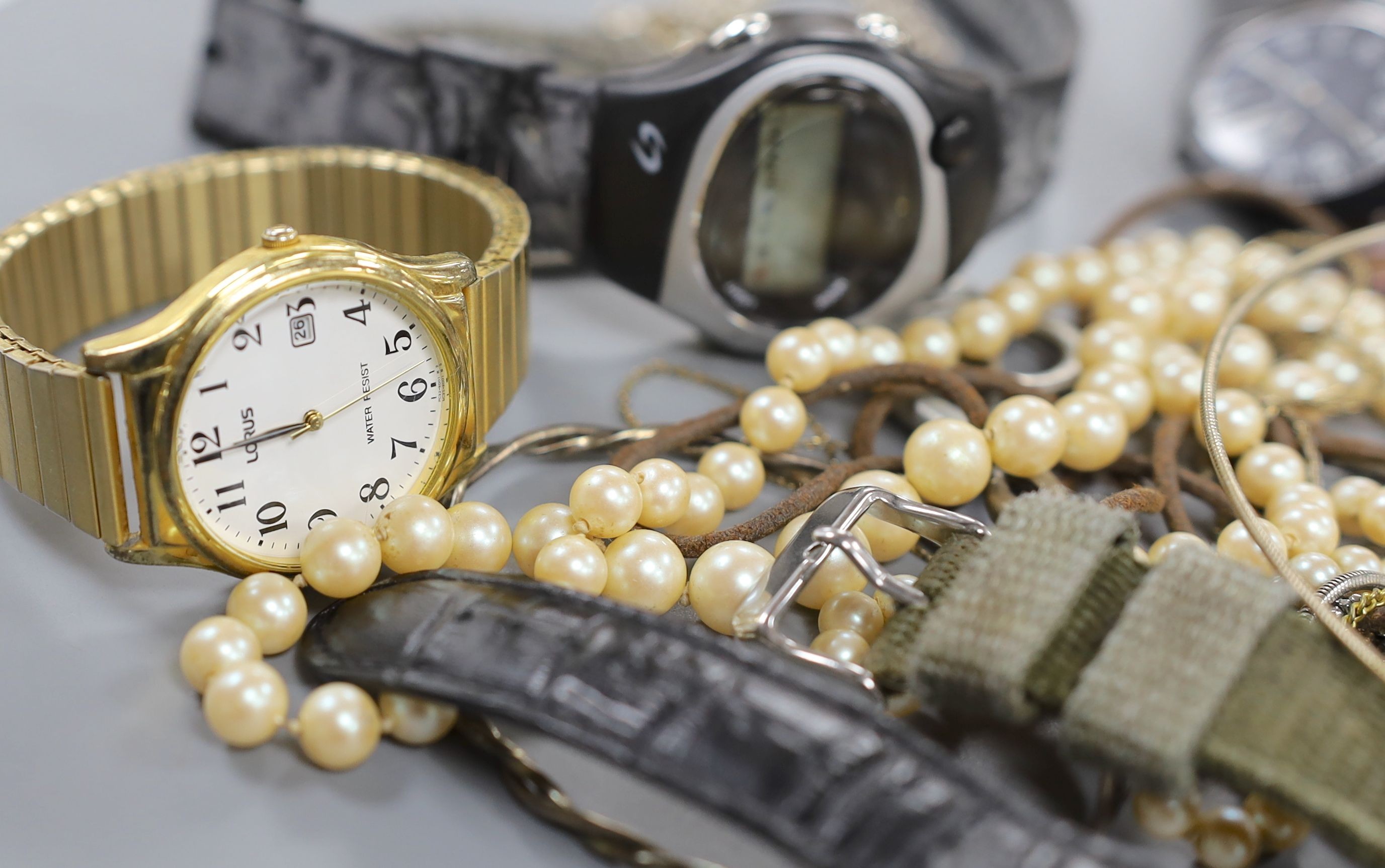 A small quantity of modern minor wrist watches and assorted costume jewellery.